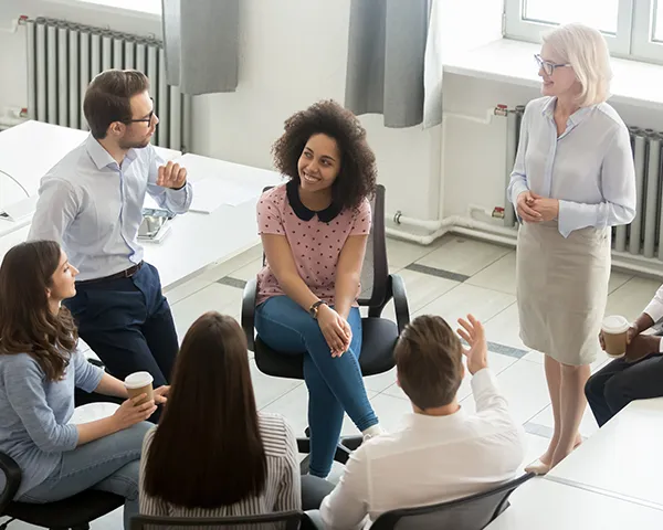 A team going through business plans and ideas in a conference room.